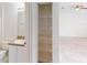 Bathroom featuring a single sink vanity, large mirror, and a linen closet at 20370 Mount Prospect Ave, Port Charlotte, FL 33952
