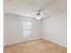 Neutral bedroom features a ceiling fan, a window, and neutral carpet at 20370 Mount Prospect Ave, Port Charlotte, FL 33952
