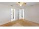Spacious bedroom with neutral carpet and view of the bathroom and walk-in closet at 20370 Mount Prospect Ave, Port Charlotte, FL 33952