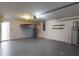 Attached garage features neutral paint, large door, storage, and ample room for two vehicles at 20370 Mount Prospect Ave, Port Charlotte, FL 33952