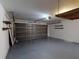 Attached garage featuring neutral paint, large door, storage and ample room for two vehicles at 20370 Mount Prospect Ave, Port Charlotte, FL 33952