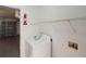 Clean laundry room with a white washing machine, shelving, and access to the garage at 20370 Mount Prospect Ave, Port Charlotte, FL 33952