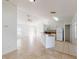 Open-concept kitchen and living room with tile flooring and lots of natural light at 20370 Mount Prospect Ave, Port Charlotte, FL 33952