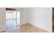 Bright living room with sliding glass doors to the outside patio and neutral tile flooring at 20370 Mount Prospect Ave, Port Charlotte, FL 33952