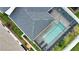 Aerial view of the house roof and lanai with sparkling screened pool and beautiful backyard at 2208 Darley Oak Way, North Port, FL 34289
