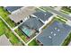 Aerial view of a home featuring a screened-in pool and well-maintained landscaping at 2208 Darley Oak Way, North Port, FL 34289