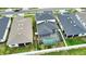 Aerial view of backyard pool and screened lanai at 2208 Darley Oak Way, North Port, FL 34289