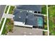 Home with a screened pool and well-kept landscaping at 2208 Darley Oak Way, North Port, FL 34289