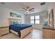 Comfortable bedroom featuring a ceiling fan and a window with shutters at 2208 Darley Oak Way, North Port, FL 34289