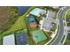 Aerial view of community amenities: a pool, playground, basketball court, and convenient parking at 2208 Darley Oak Way, North Port, FL 34289