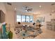 Cozy living room with a ceiling fan and a view of the lanai at 2208 Darley Oak Way, North Port, FL 34289