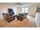 Upstairs living room with plush seating, a ceiling fan, TV and shuttered windows at 2208 Darley Oak Way, North Port, FL 34289