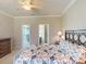 Light and airy bedroom with a large bed and views into closet and bathroom areas at 2444 Daisy Dr, North Port, FL 34289