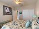 Bright bedroom showcasing a queen-sized bed with decorative pillows, closet and stylish decor at 2444 Daisy Dr, North Port, FL 34289