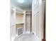 Walk-in closet with built-in shelving, shoe storage and rod, providing ample storage space at 2444 Daisy Dr, North Port, FL 34289