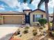Charming single Gathering home with a well-manicured lawn, a two-car garage and a decorative walkway at 2444 Daisy Dr, North Port, FL 34289