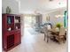 Open concept living room and dining area with neutral colors and tile flooring at 2444 Daisy Dr, North Port, FL 34289
