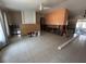 Spacious living room featuring tile floors, ceiling fan, and natural light, ready for renovation at 3120 Wisteria Pl, Punta Gorda, FL 33950