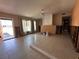 Open-concept living room undergoing renovations with tile flooring and natural light at 3120 Wisteria Pl, Punta Gorda, FL 33950