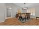 Charming dining room with wood floors, natural light, and a modern light fixture at 73 Santarem Cir, Punta Gorda, FL 33983