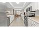 Spacious kitchen showcasing modern appliances, ample cabinetry, and an open layout perfect for entertaining at 73 Santarem Cir, Punta Gorda, FL 33983