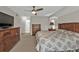 Spacious bedroom featuring soft carpet, ceiling fan, and lots of storage at 73 Santarem Cir, Punta Gorda, FL 33983