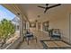 Inviting covered patio with tile flooring, ceiling fans, and comfortable seating area at 73 Santarem Cir, Punta Gorda, FL 33983