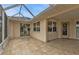 The covered patio has tile flooring, screens, and plenty of space for outdoor relaxation at 73 Santarem Cir, Punta Gorda, FL 33983