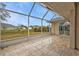 Spacious screened porch with tiled floor offering serene outdoor views at 73 Santarem Cir, Punta Gorda, FL 33983