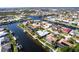 Desirable waterfront home with a private dock, screened-in lanai, and beautifully landscaped yard nestled in canal community at 936 Lassino Ct, Punta Gorda, FL 33950