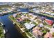 Waterfront property on a canal featuring private boat dock access, canal views, and lush tropical landscaping at 936 Lassino Ct, Punta Gorda, FL 33950