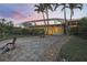 Backyard featuring pool, a landscaped pathway and privacy landscaping at 936 Lassino Ct, Punta Gorda, FL 33950