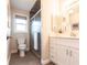 This bathroom features a single vanity with drawers and a tiled shower with glass doors at 936 Lassino Ct, Punta Gorda, FL 33950
