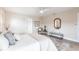 Comfortable bedroom with neutral tones, wood-look floors, and relaxing decor at 936 Lassino Ct, Punta Gorda, FL 33950