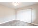 This bedroom features light walls, light wood floors, a ceiling fan, and a large closet at 936 Lassino Ct, Punta Gorda, FL 33950