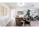 Dining area features modern lighting, comfortable seating, and tile flooring at 936 Lassino Ct, Punta Gorda, FL 33950