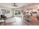 Kitchen, barstool seating, and sliding glass doors to the screened pool area at 936 Lassino Ct, Punta Gorda, FL 33950