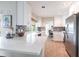 Bright kitchen featuring white countertops, stainless appliances, and modern fixtures at 936 Lassino Ct, Punta Gorda, FL 33950
