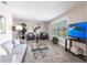 Bright living room with tile floors, plantation shutters, and modern furnishings at 936 Lassino Ct, Punta Gorda, FL 33950