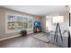 Bright living room showcasing tile floors, large windows, and comfortable seating at 936 Lassino Ct, Punta Gorda, FL 33950