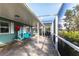 Covered patio features tile flooring, recreation equipment, and views of the surrounding landscape at 936 Lassino Ct, Punta Gorda, FL 33950