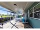 Covered outdoor patio with an extended screened-in area leading to the pool at 936 Lassino Ct, Punta Gorda, FL 33950