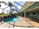 Inviting screened pool with an attached patio area, ideal for year-round enjoyment and relaxation at 936 Lassino Ct, Punta Gorda, FL 33950