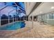 Enclosed pool area with tiled flooring, ample seating and sunset views at 936 Lassino Ct, Punta Gorda, FL 33950