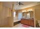Luxurious bathroom with a soaking tub, walk-in shower, and dual vanities at 1675 Blue Lake Cir, Punta Gorda, FL 33983