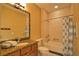 Well-maintained bathroom with a vanity, granite countertop, and shower-tub combination at 1675 Blue Lake Cir, Punta Gorda, FL 33983