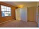 Cozy bedroom with natural light, closet space, and neutral color palette at 1675 Blue Lake Cir, Punta Gorda, FL 33983