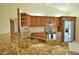 Well-equipped kitchen with granite counters, stainless steel appliances, and wood cabinets at 1675 Blue Lake Cir, Punta Gorda, FL 33983