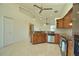 Open kitchen with granite counters, stainless steel appliances, and tile flooring at 1675 Blue Lake Cir, Punta Gorda, FL 33983