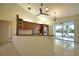 Well-equipped kitchen with granite counters, stainless steel appliances and access to outdoor space at 1675 Blue Lake Cir, Punta Gorda, FL 33983